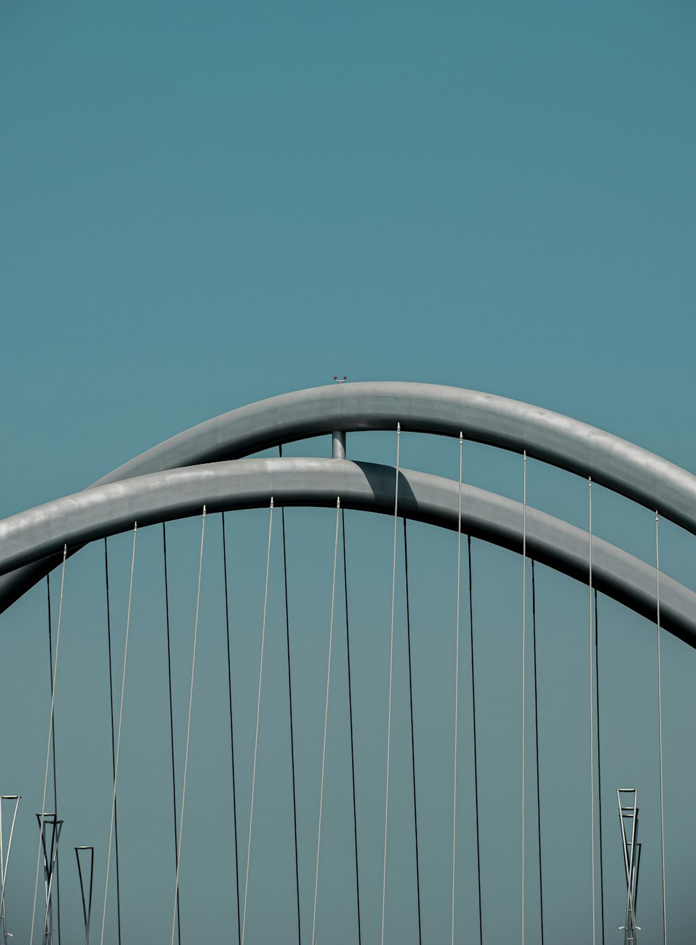 an airplane flying over a bridge in the sky