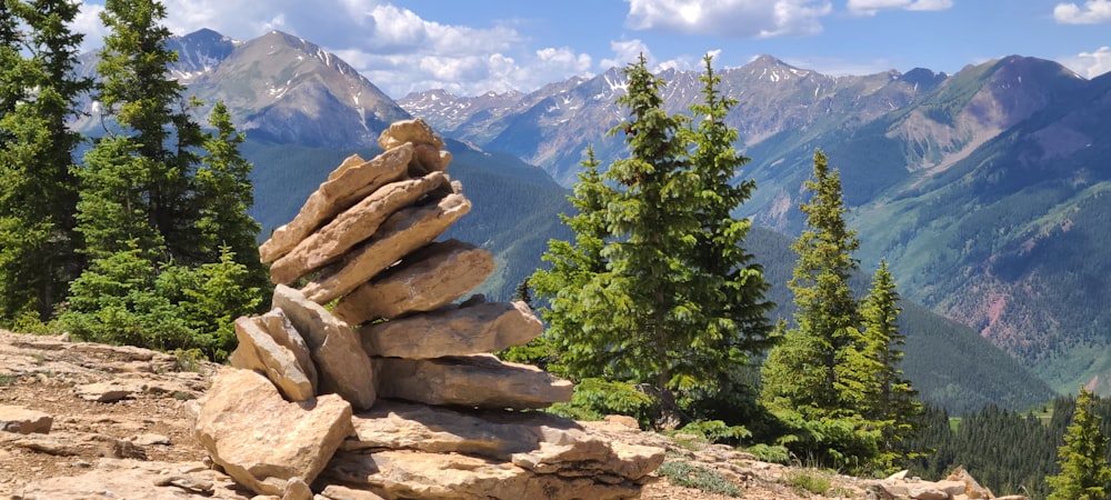 a pile of rocks sitting on top of a mountain