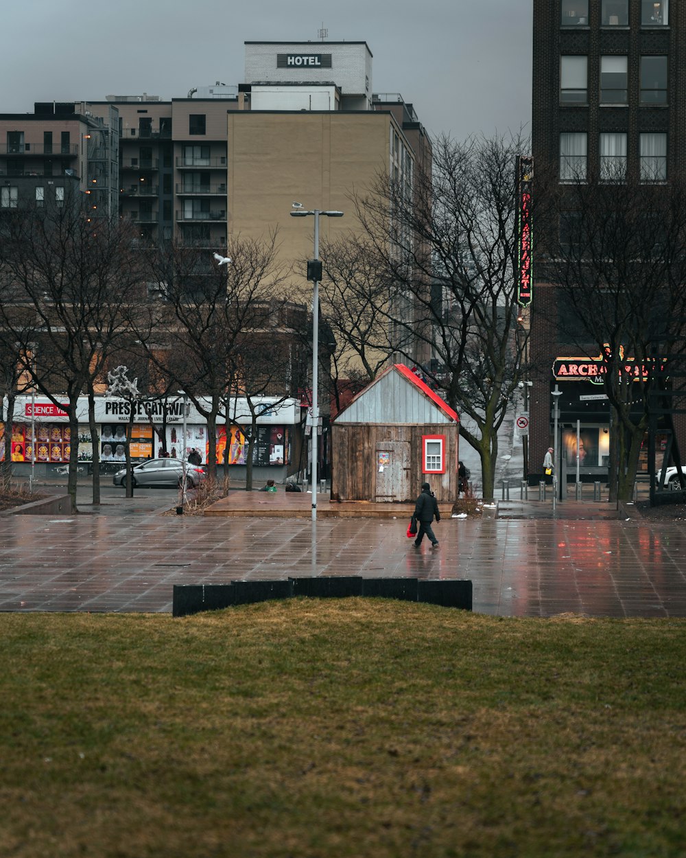 a group of people walking on a city street