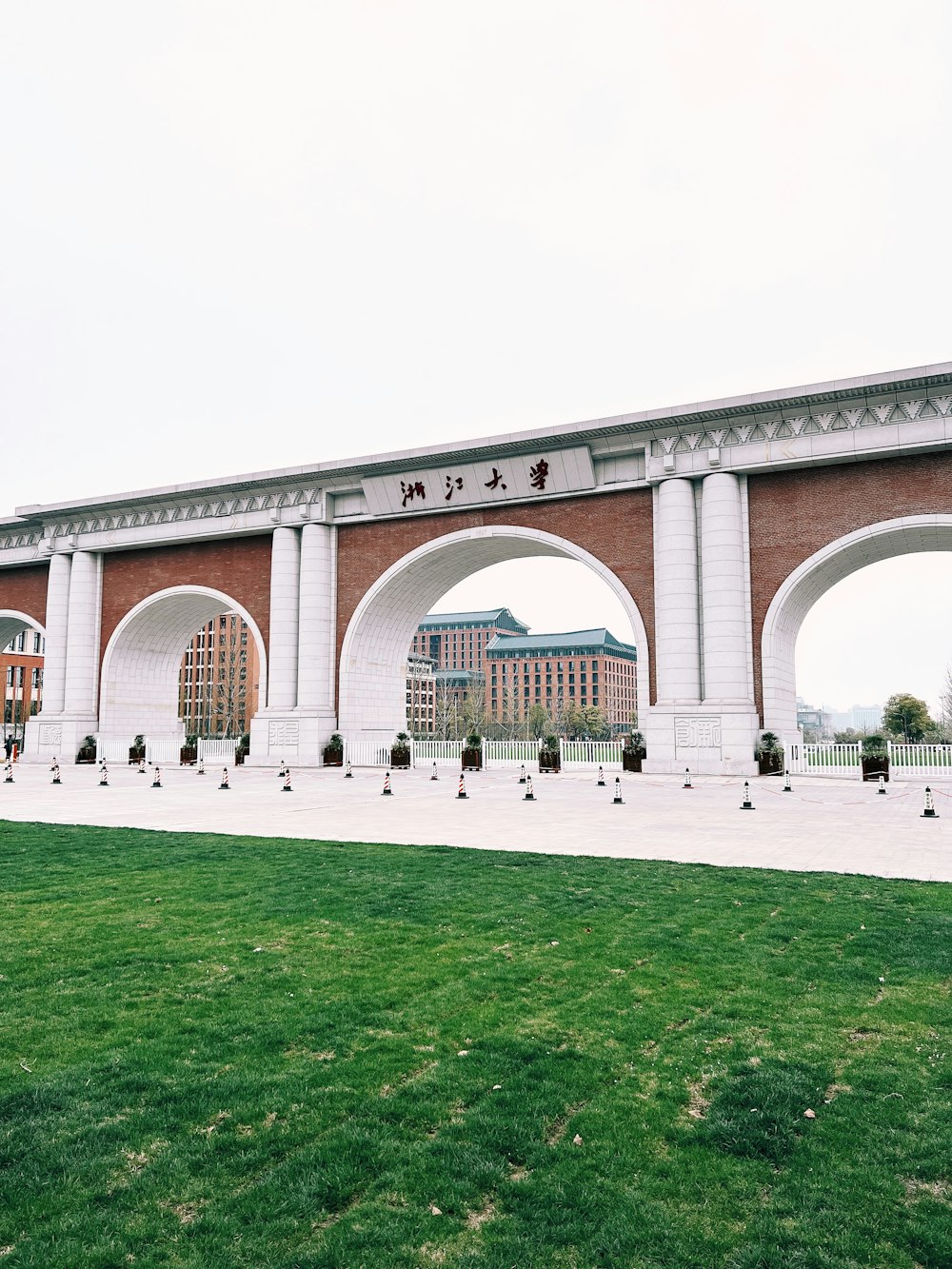 a large brick wall with arches over it