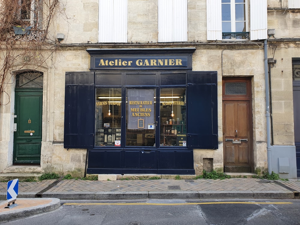 a building with a store front on the corner