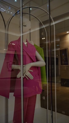 Soft blush pink 3-piece suit displayed on a mannequin with gold accents.