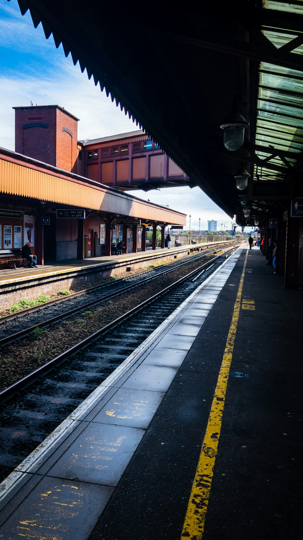 a train station with a train on the tracks