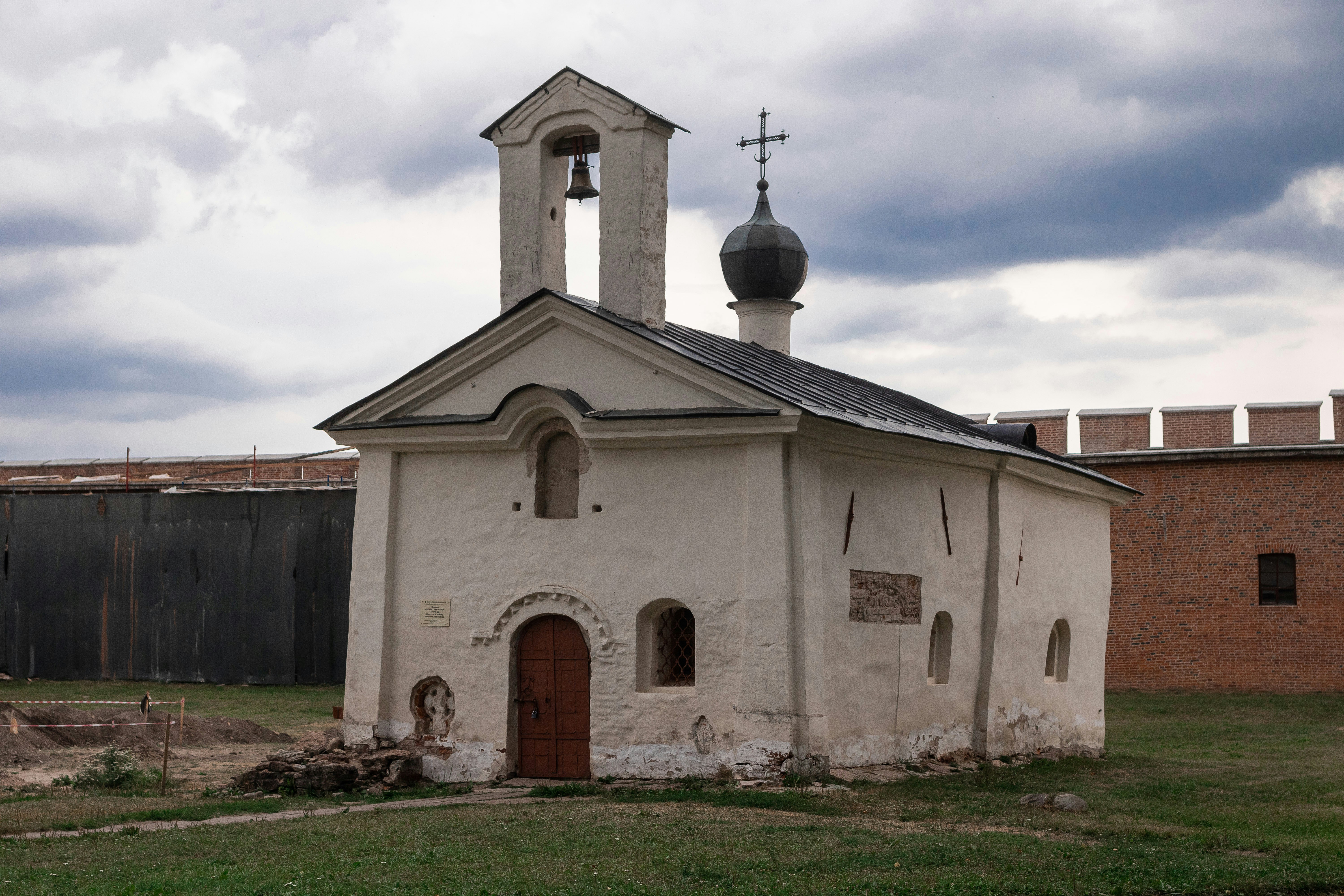 an old church with a steeple and a bell tower