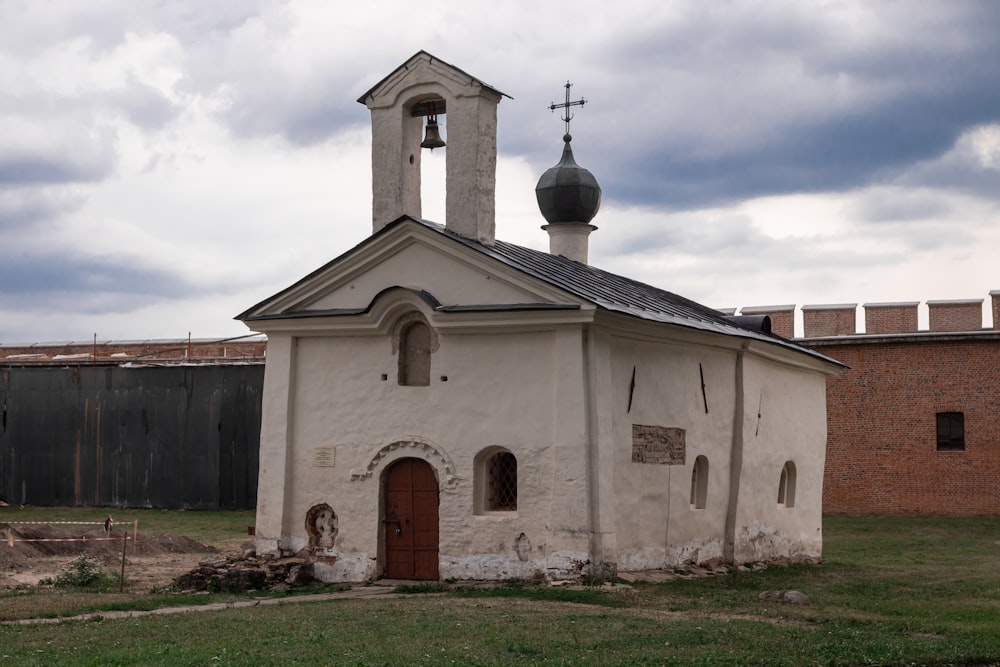 an old church with a steeple and a bell tower