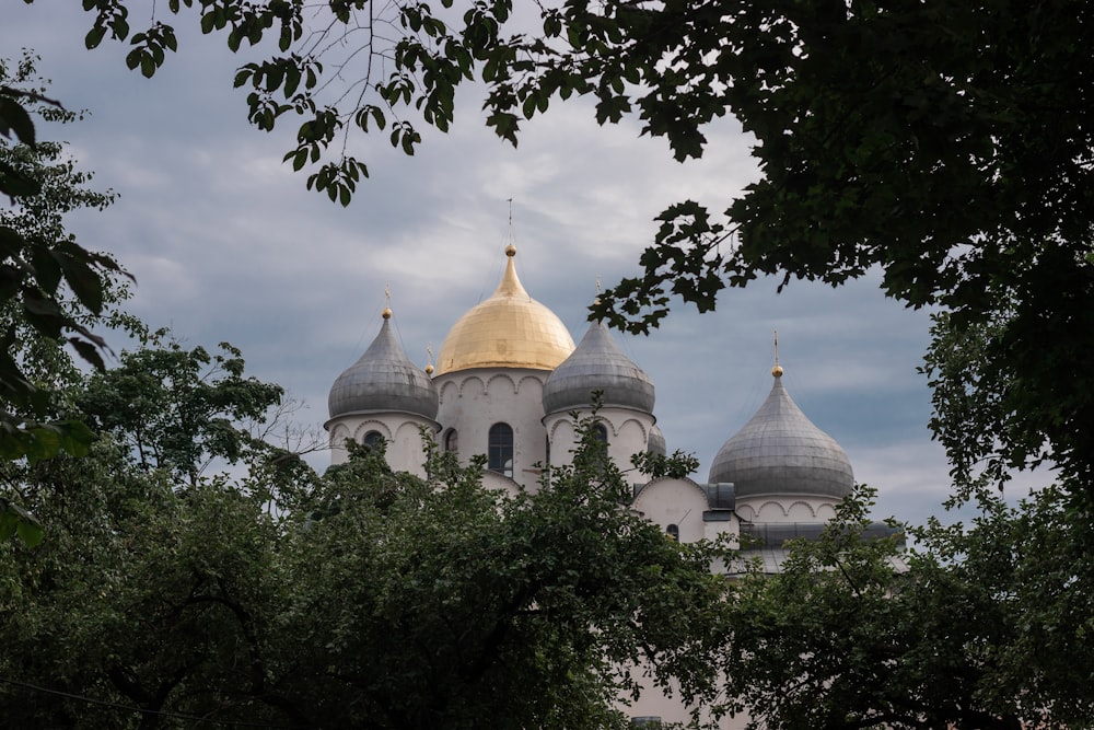 a large white building with a golden dome