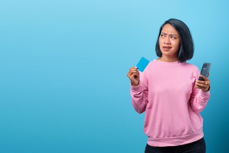 attractive woman with credit card and smartphone