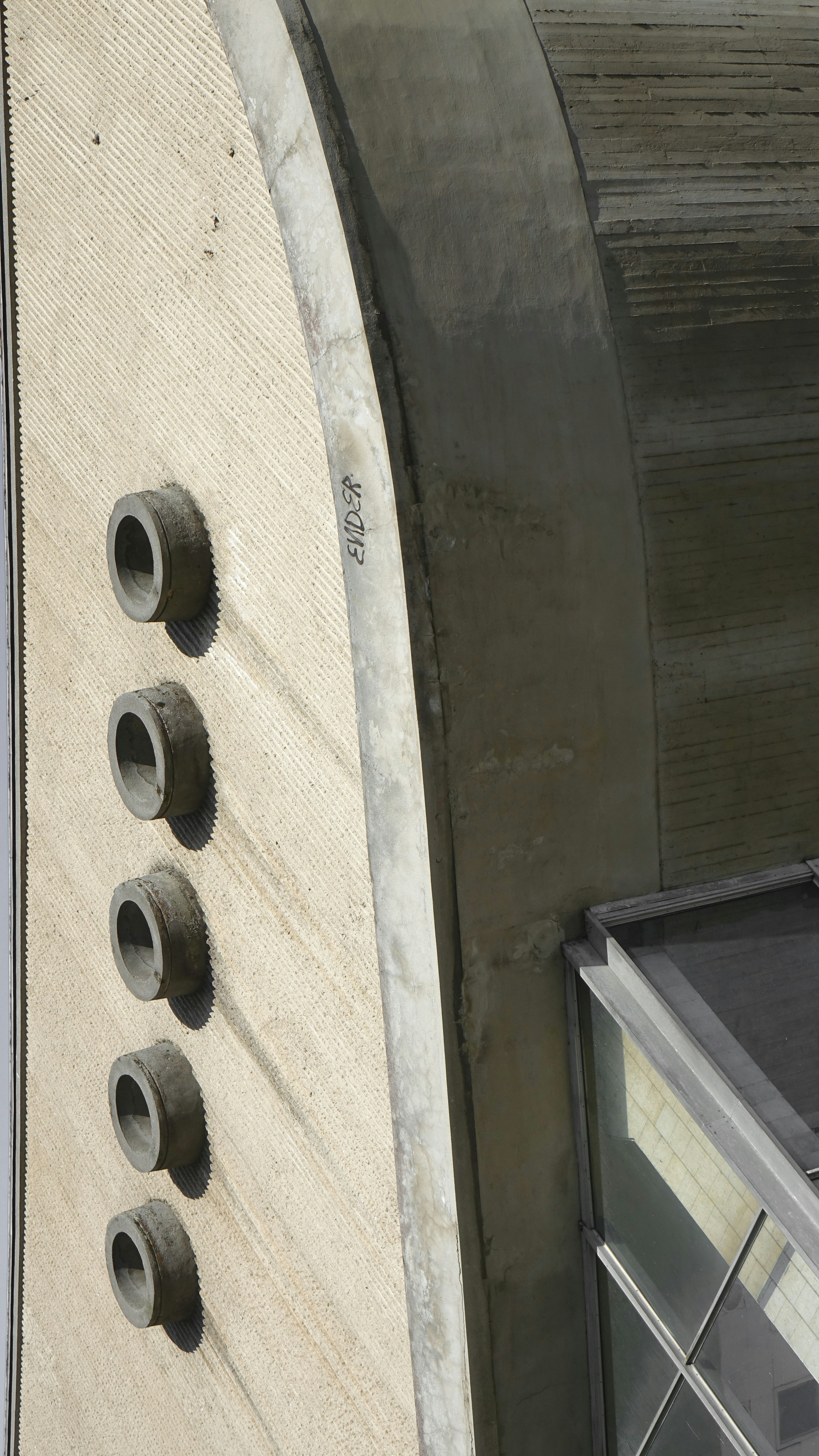 a close up of a skateboard on the side of a building