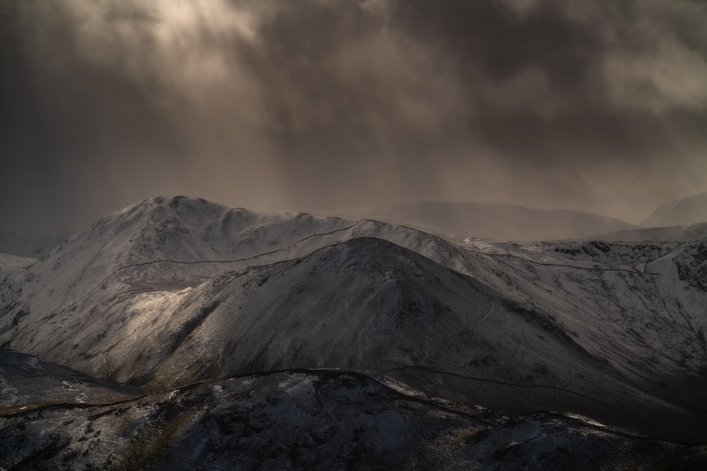 a view of a mountain range under a cloudy sky