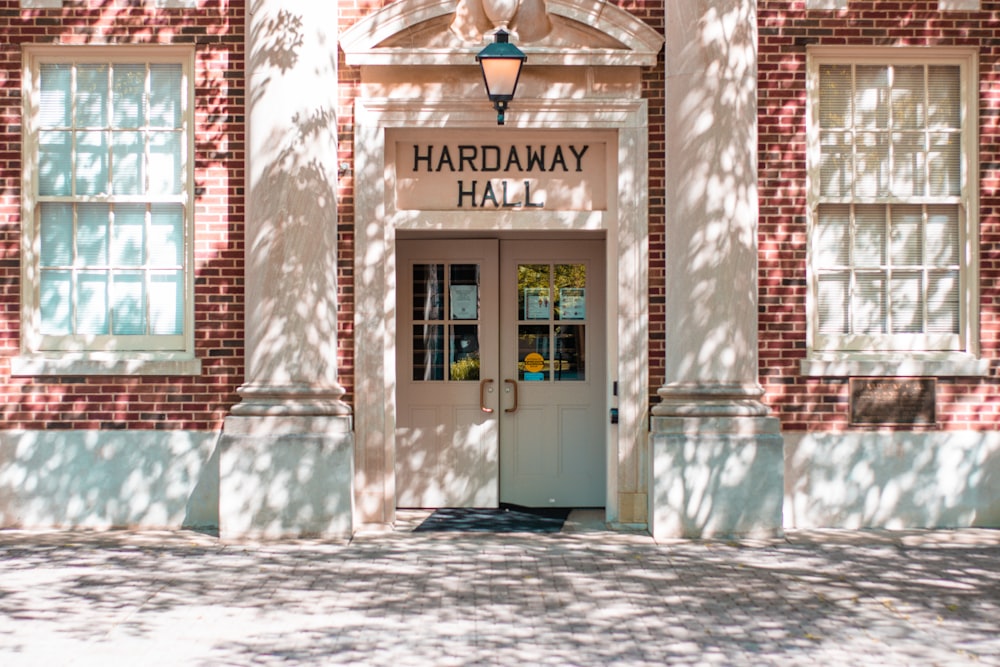 a brick building with a white door and windows