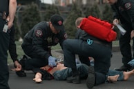 A volunteer comforting a child during a medical emergency.
