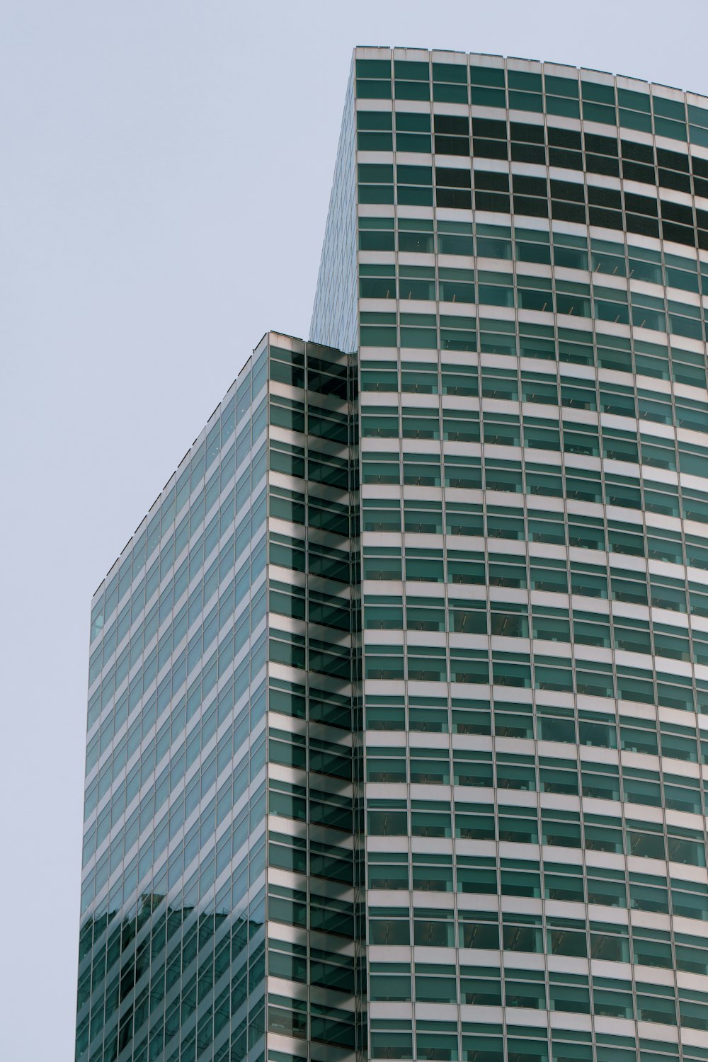 a very tall building with a clock on it's side