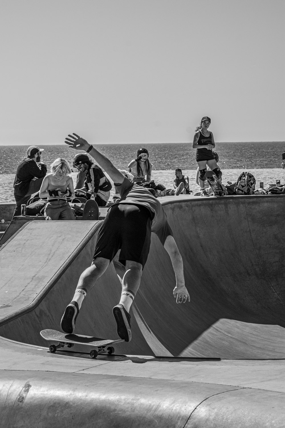 a man riding a skateboard up the side of a ramp