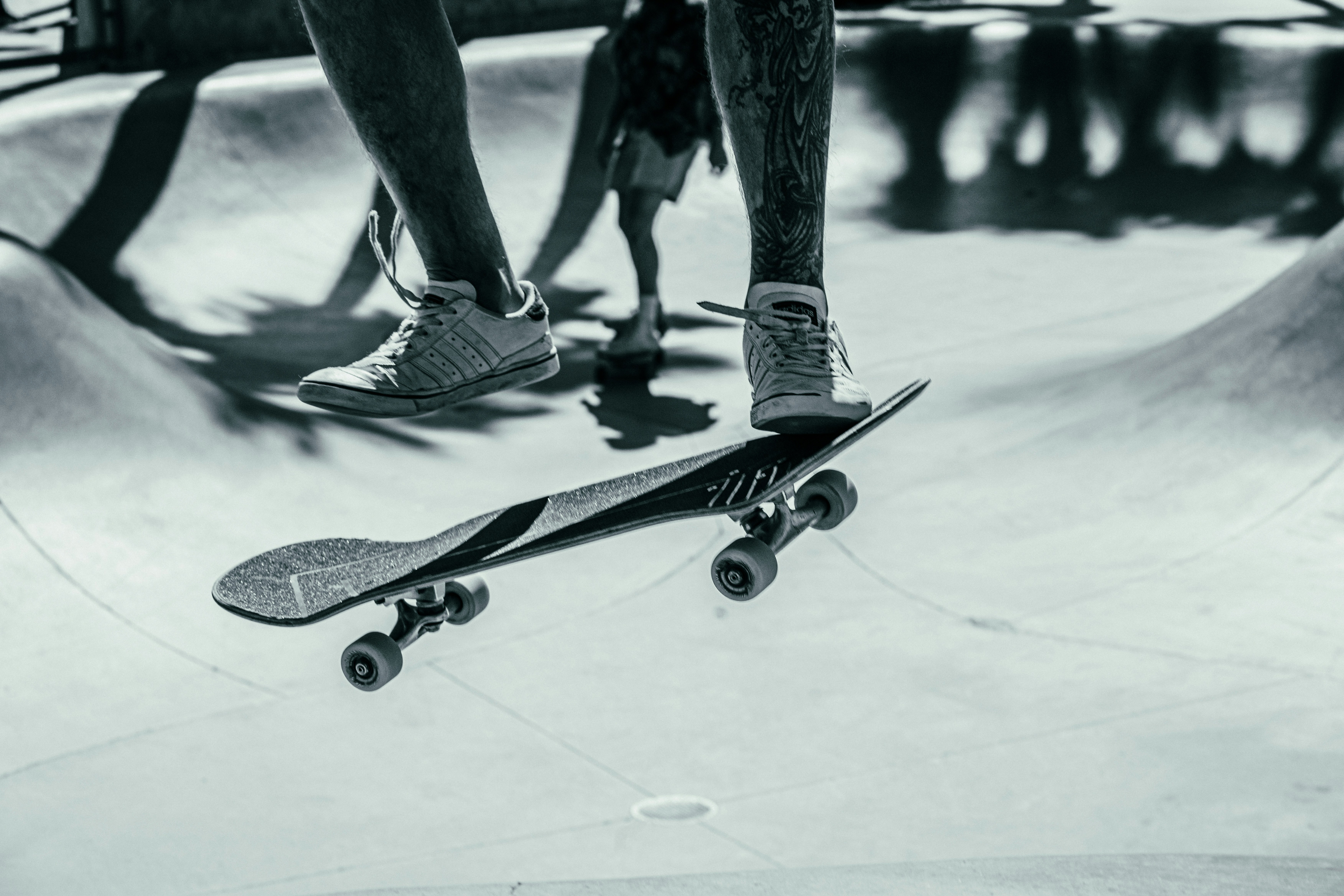 a man riding a skateboard at a skate park