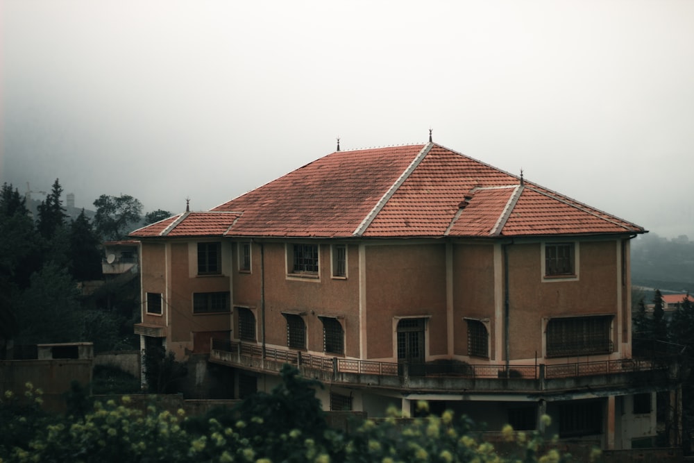 a house with a red roof and a red tiled roof