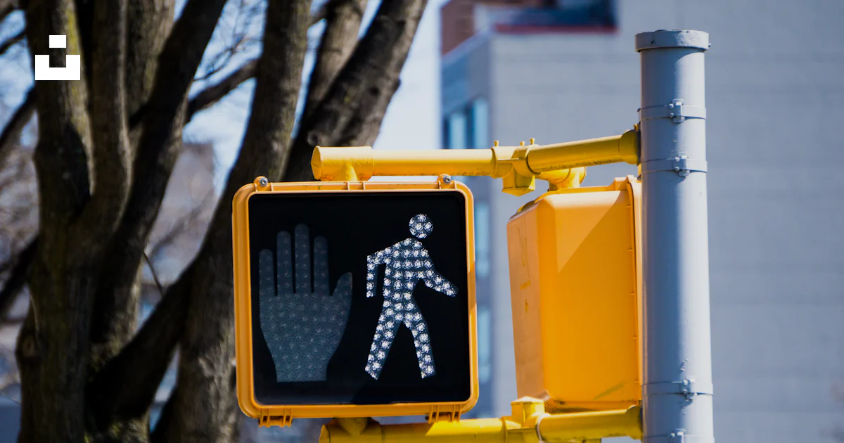 Crossing Light Sign A traffic light with a pedestrian crossing sign on it photo – Free ...