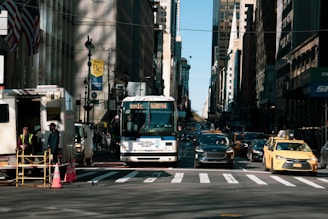 A bustling Dubai street with various vehicles and drivers.