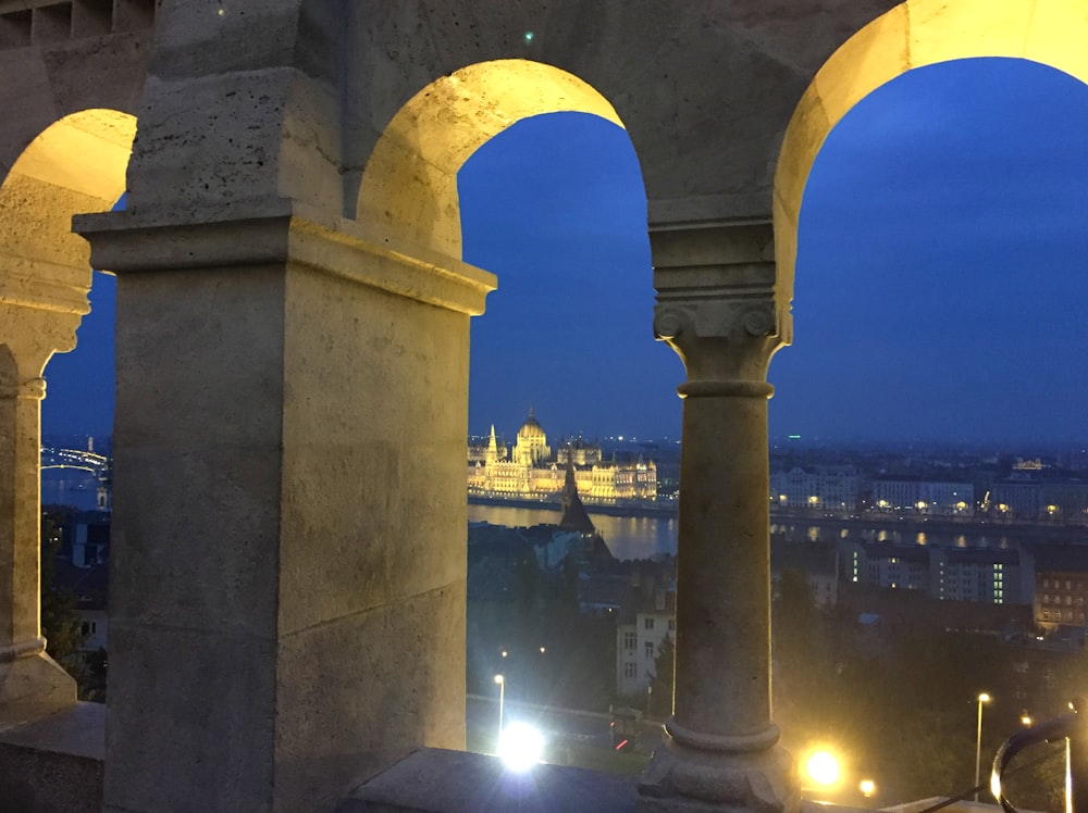 a view of a city at night from the top of a building