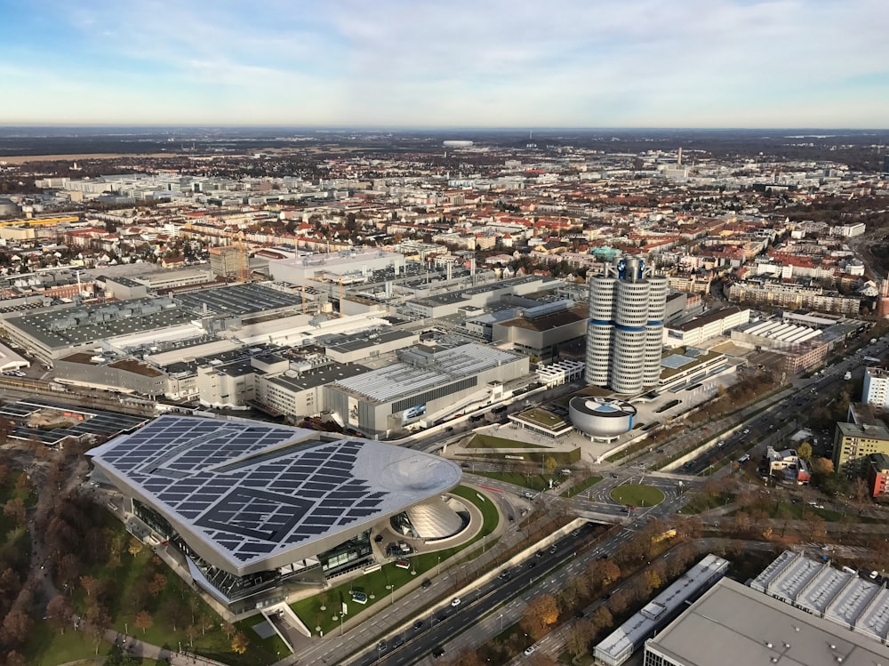 an aerial view of a city with a solar panel on the roof