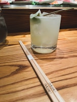 A refreshing drink served alongside a delicious sushi meal.