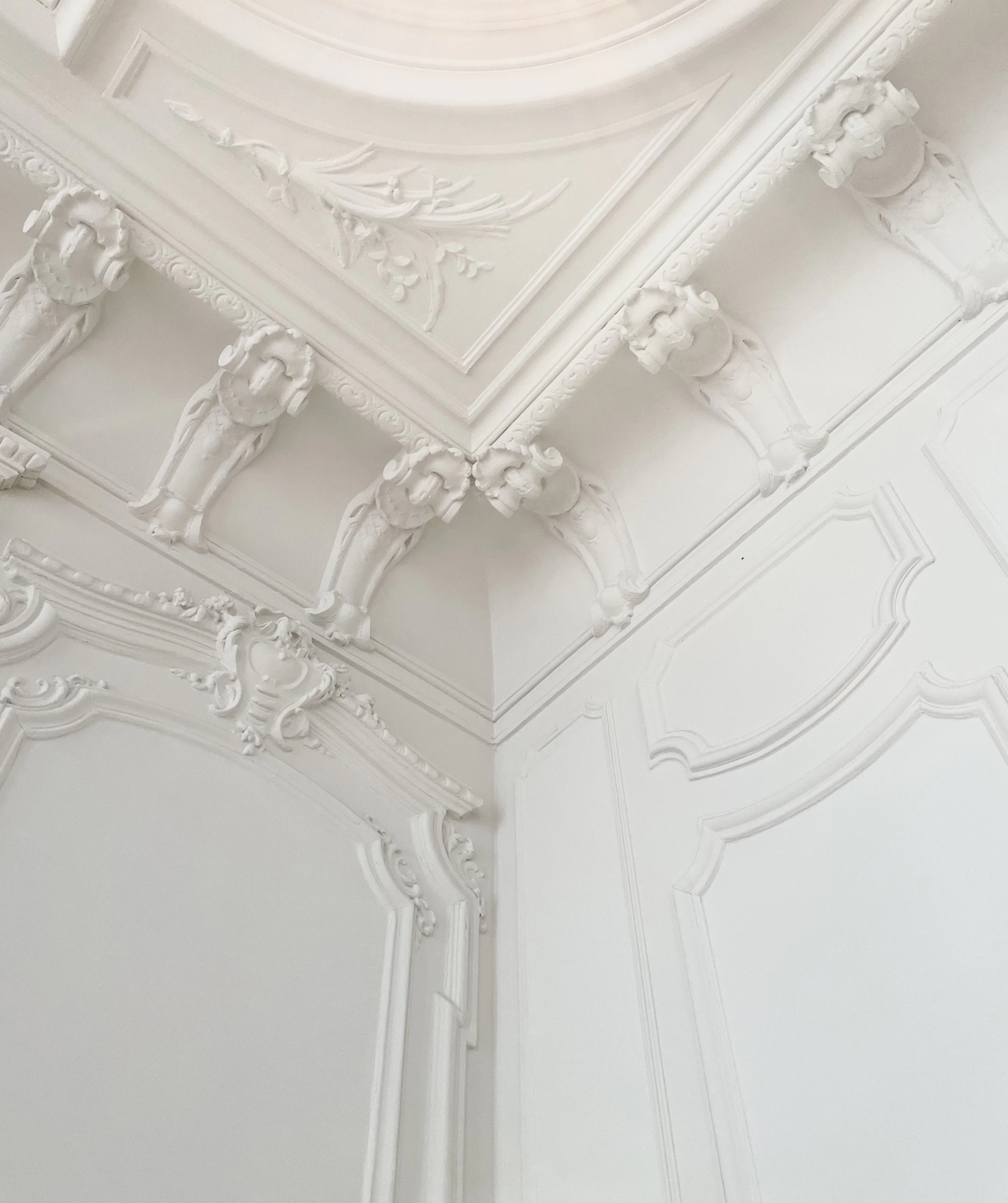 a white room with a ceiling and a light fixture