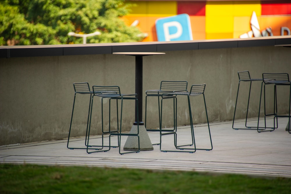 a group of chairs and a table on a sidewalk