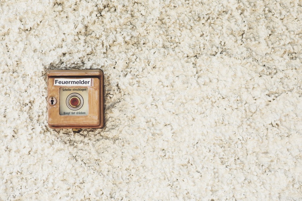 an old fashioned camera on a white carpet