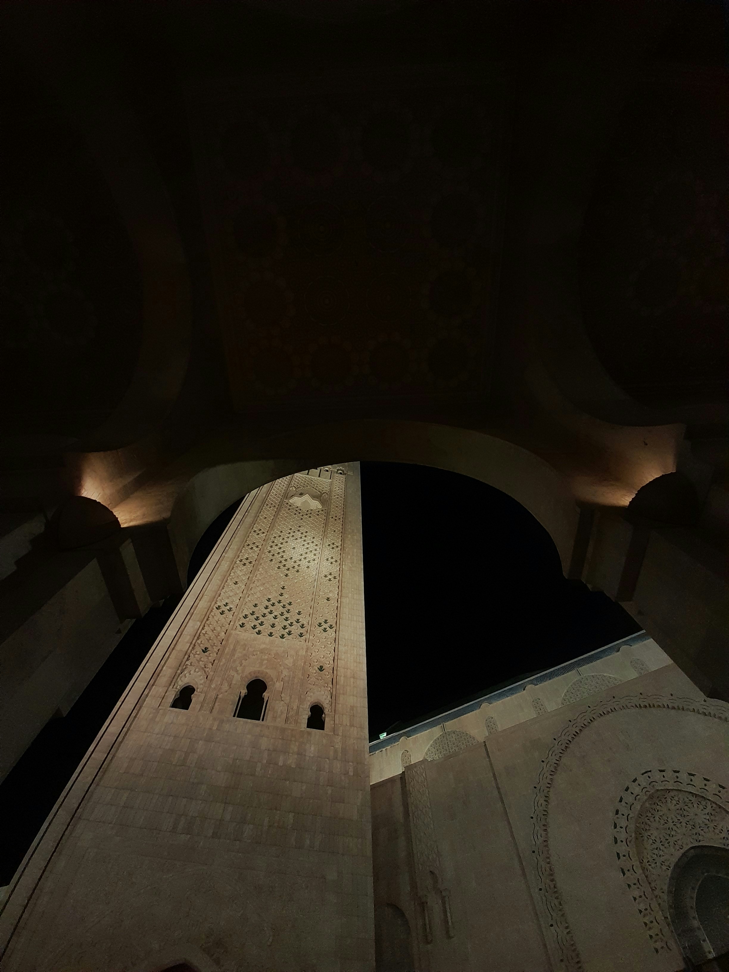 a very tall building with a clock on it's side