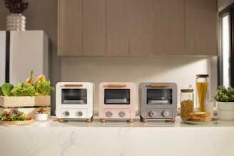 a group of toasters sitting on top of a counter