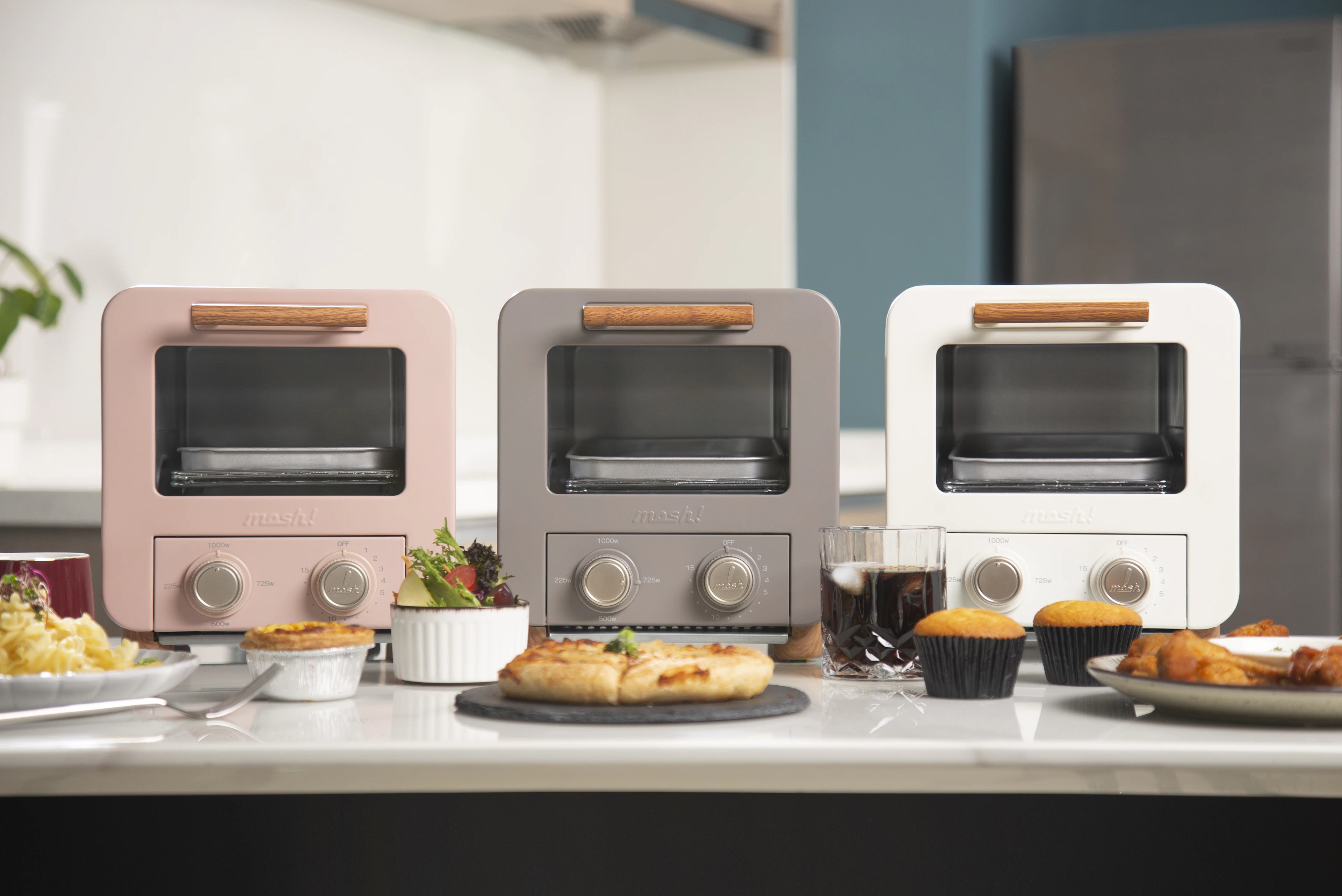A couple of toasters sitting on top of a counter
