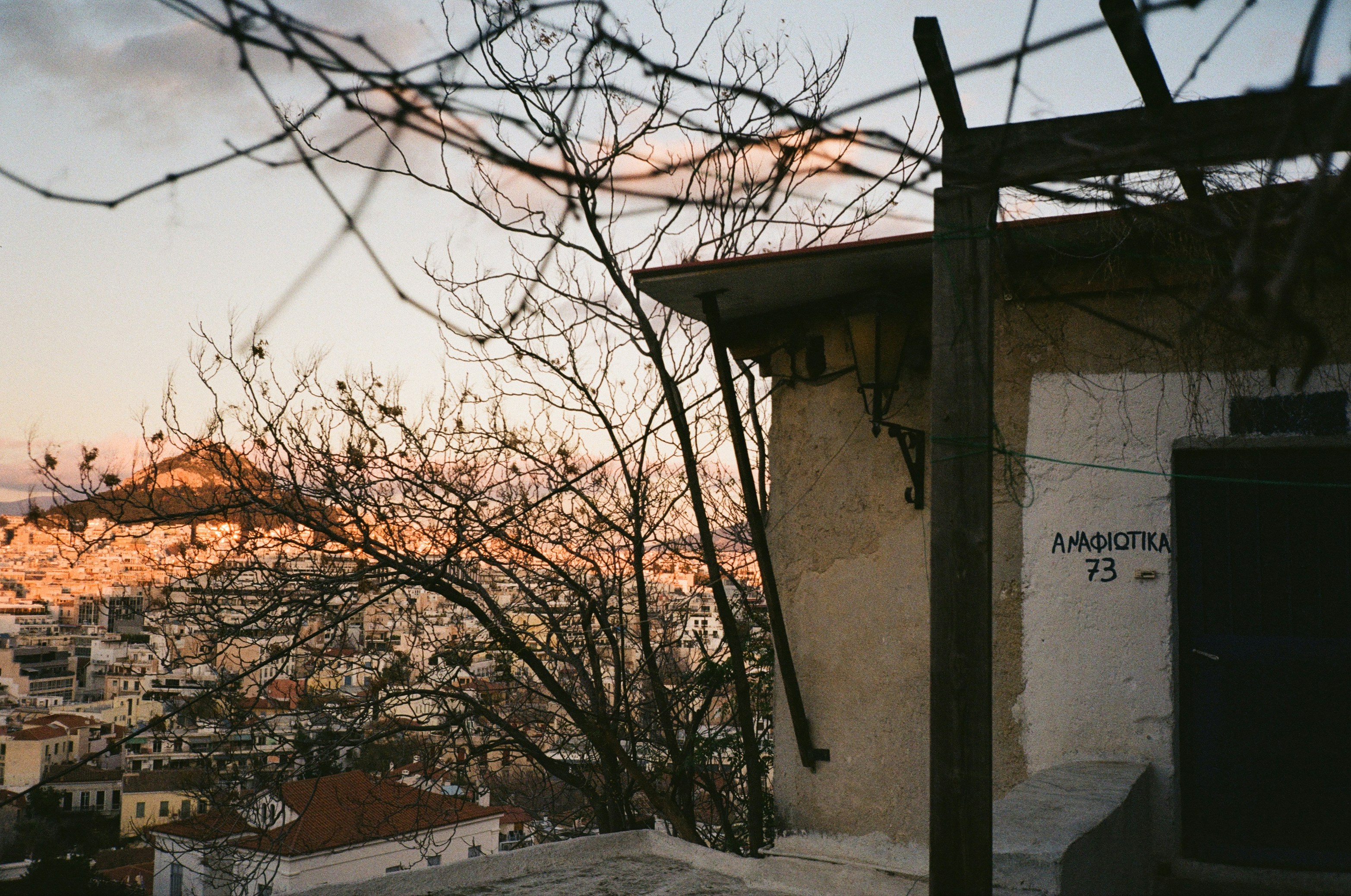 a view of a city from behind a fence