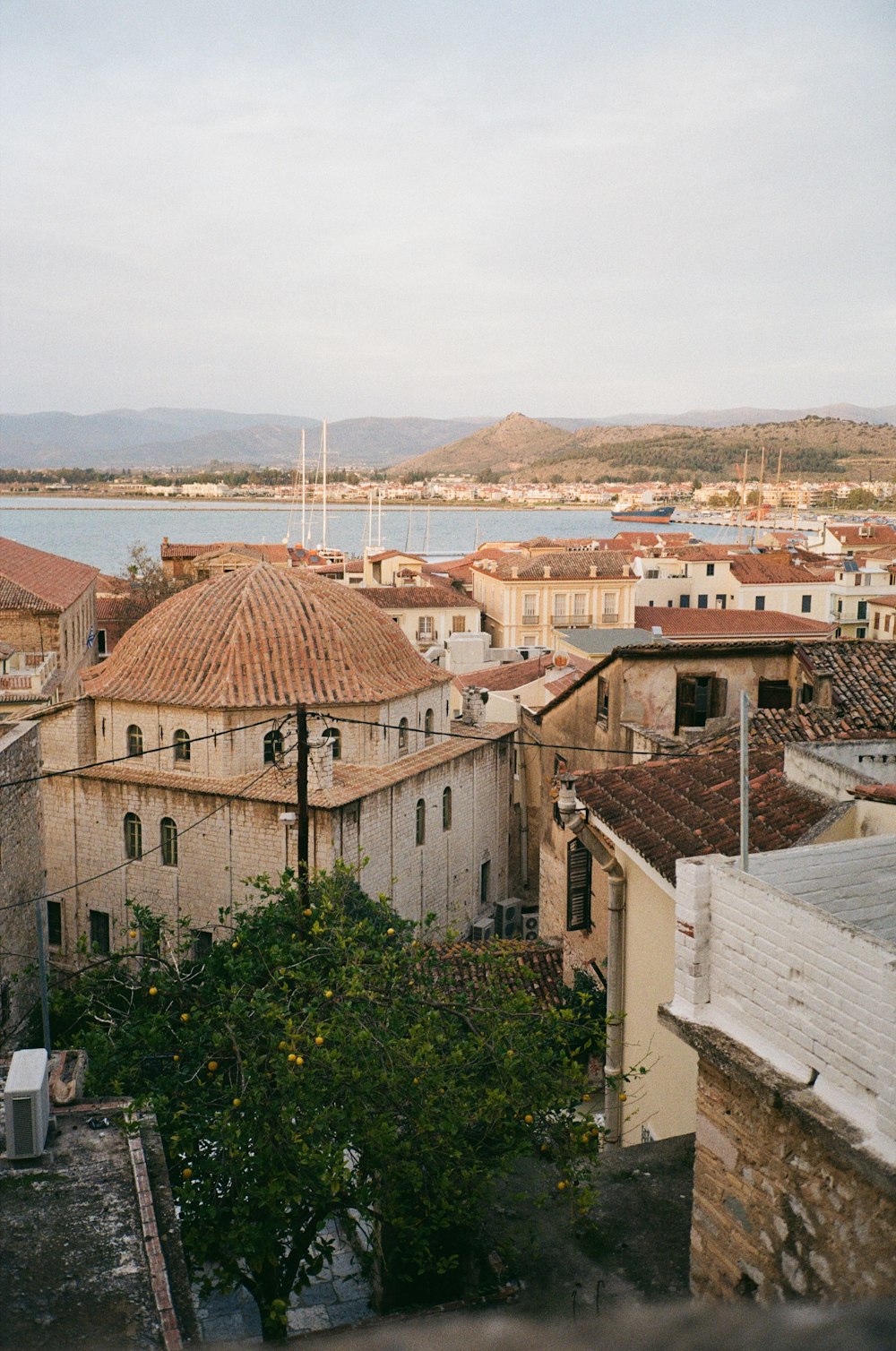 a view of some buildings and a body of water