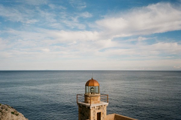 A light house sitting on top of a cliff near the ocean — Monemvasia, Greece