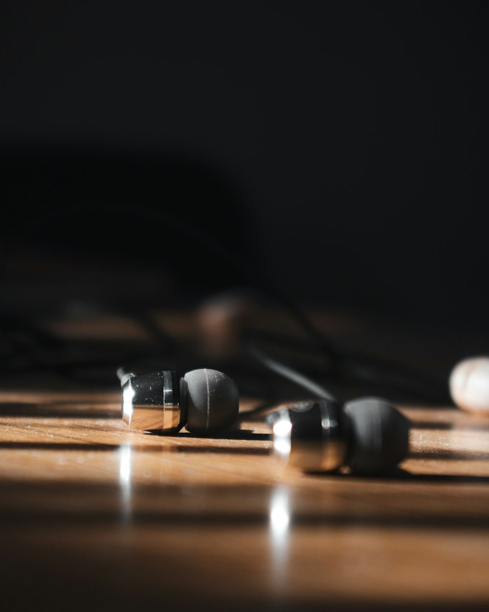 a close up of a wooden table with a bunch of knobs on it