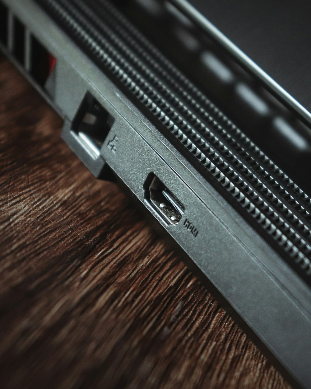 a close up of a laptop on a wooden table