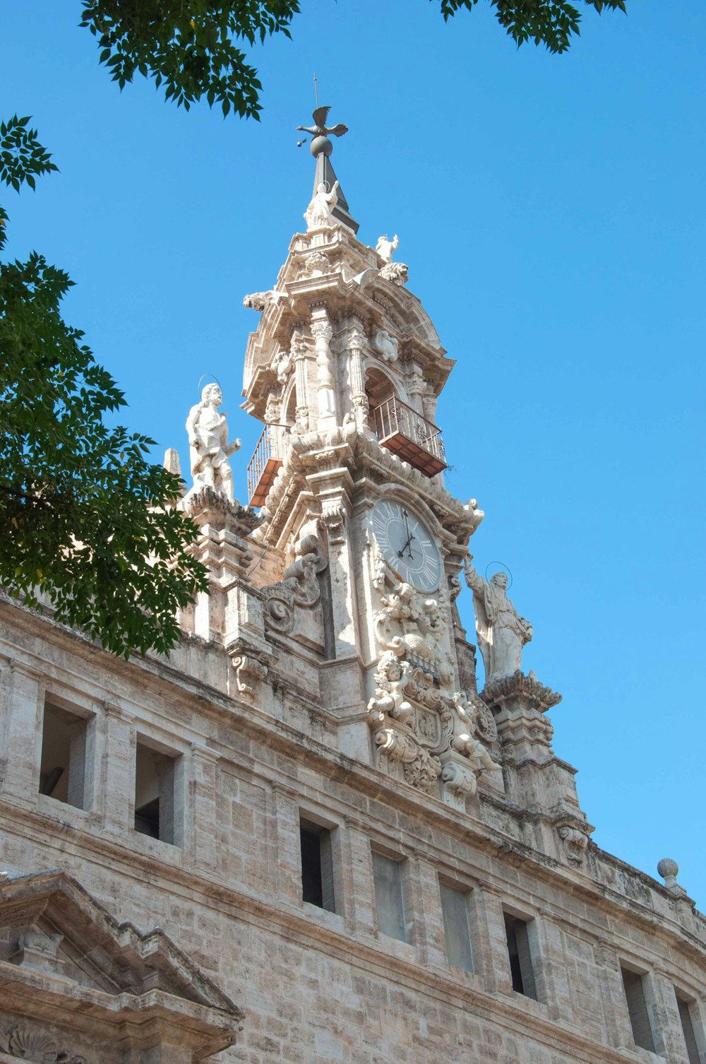 a tall building with a clock on the top of it