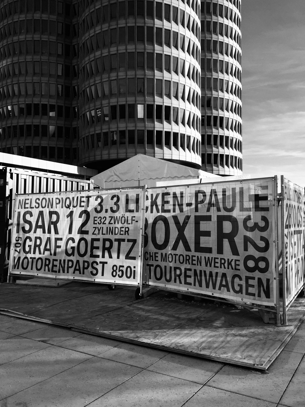 a black and white photo of a street sign