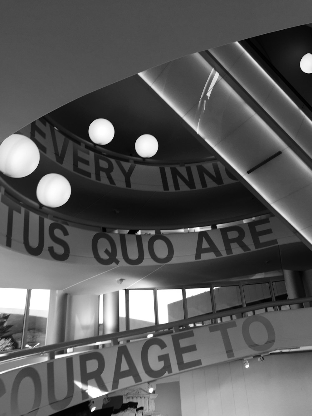 a black and white photo of a circular building