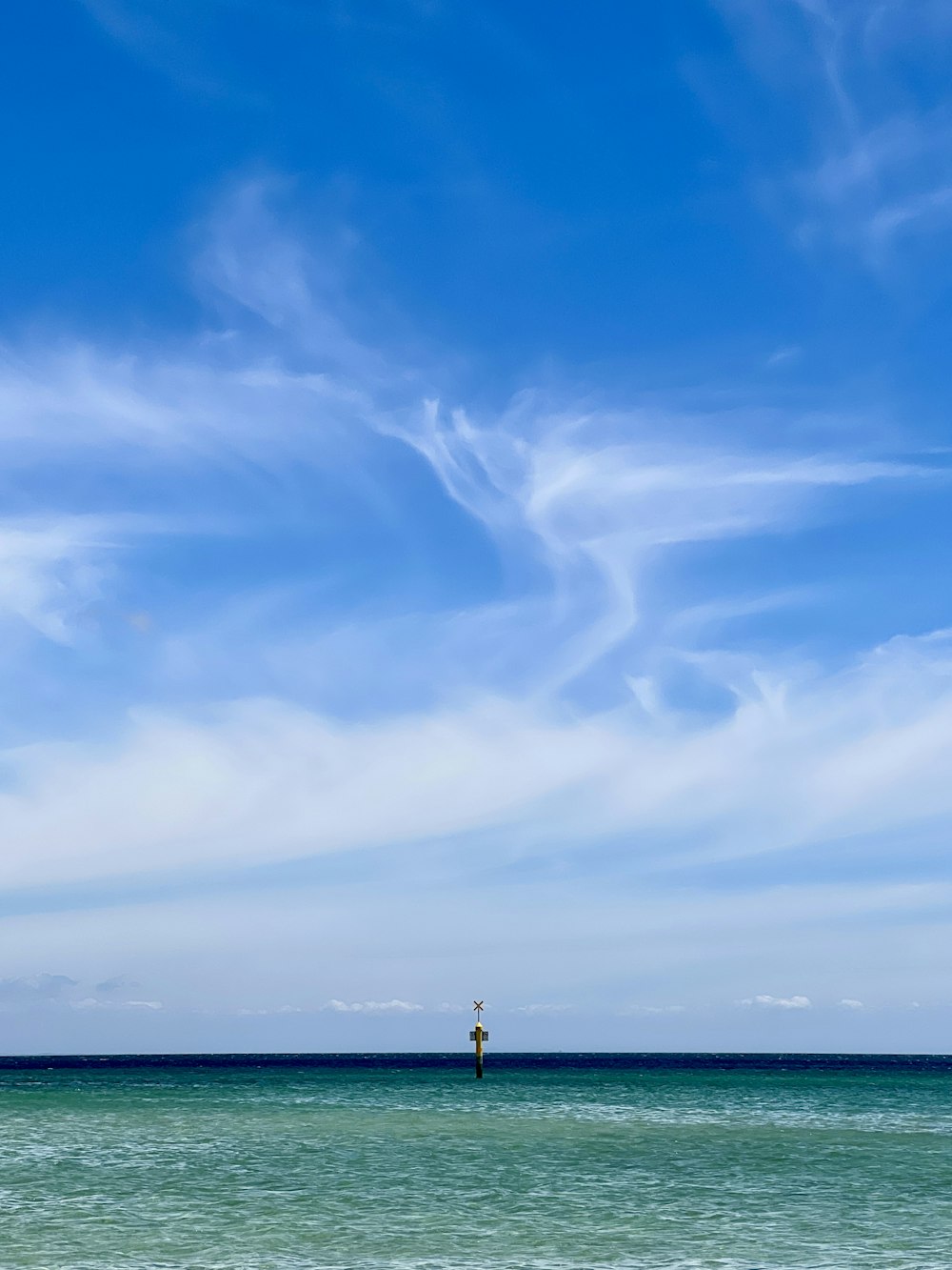 a lone boat in the middle of the ocean