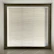 Modern bay window framed by sleek, custom hardwood shutters in a neutral-toned room.