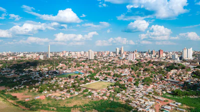 Asunción spread out below a low hill, with the Paraguay river beyond