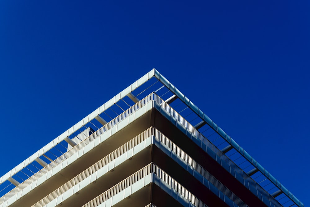 a tall building with balconies on top of it