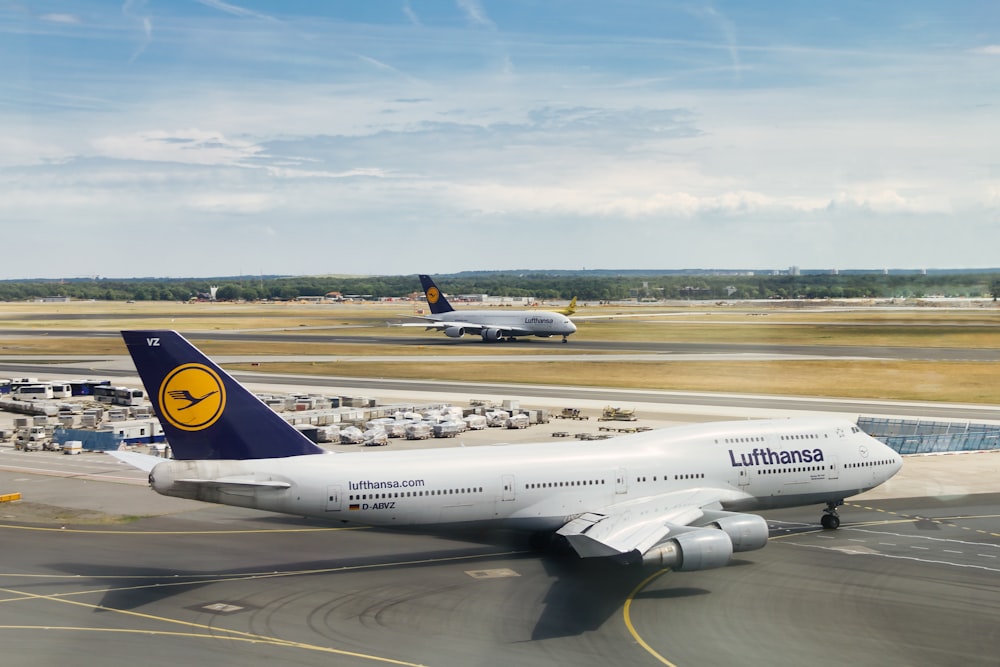 a large jetliner sitting on top of an airport tarmac