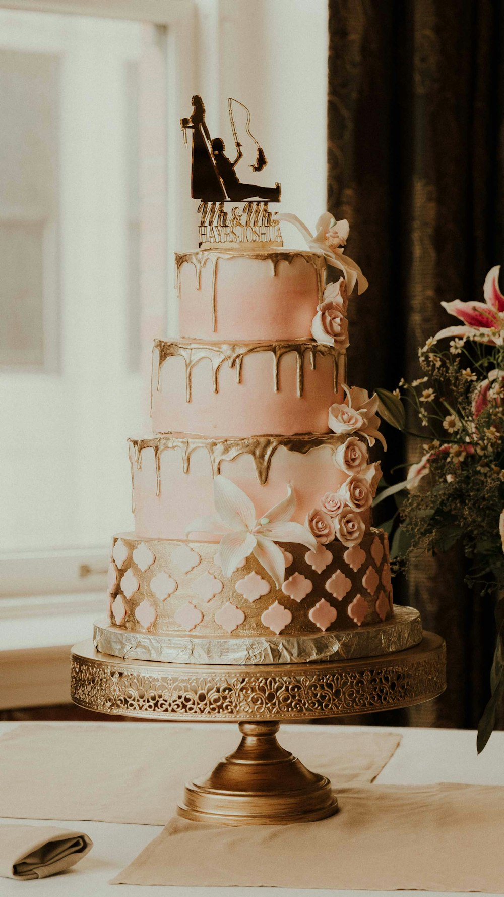 a wedding cake with a bride and groom on top