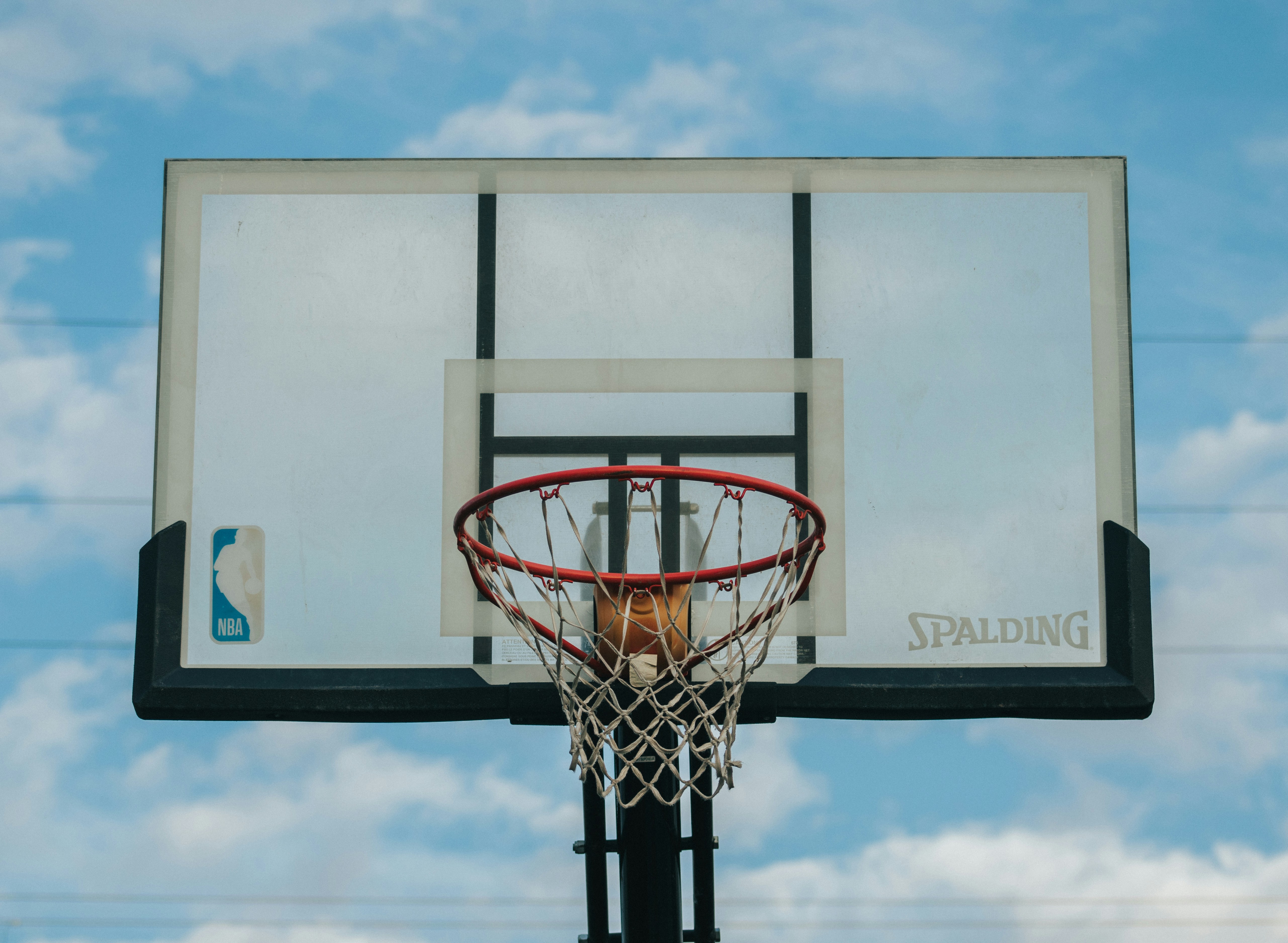 a basketball hoop with a sky background