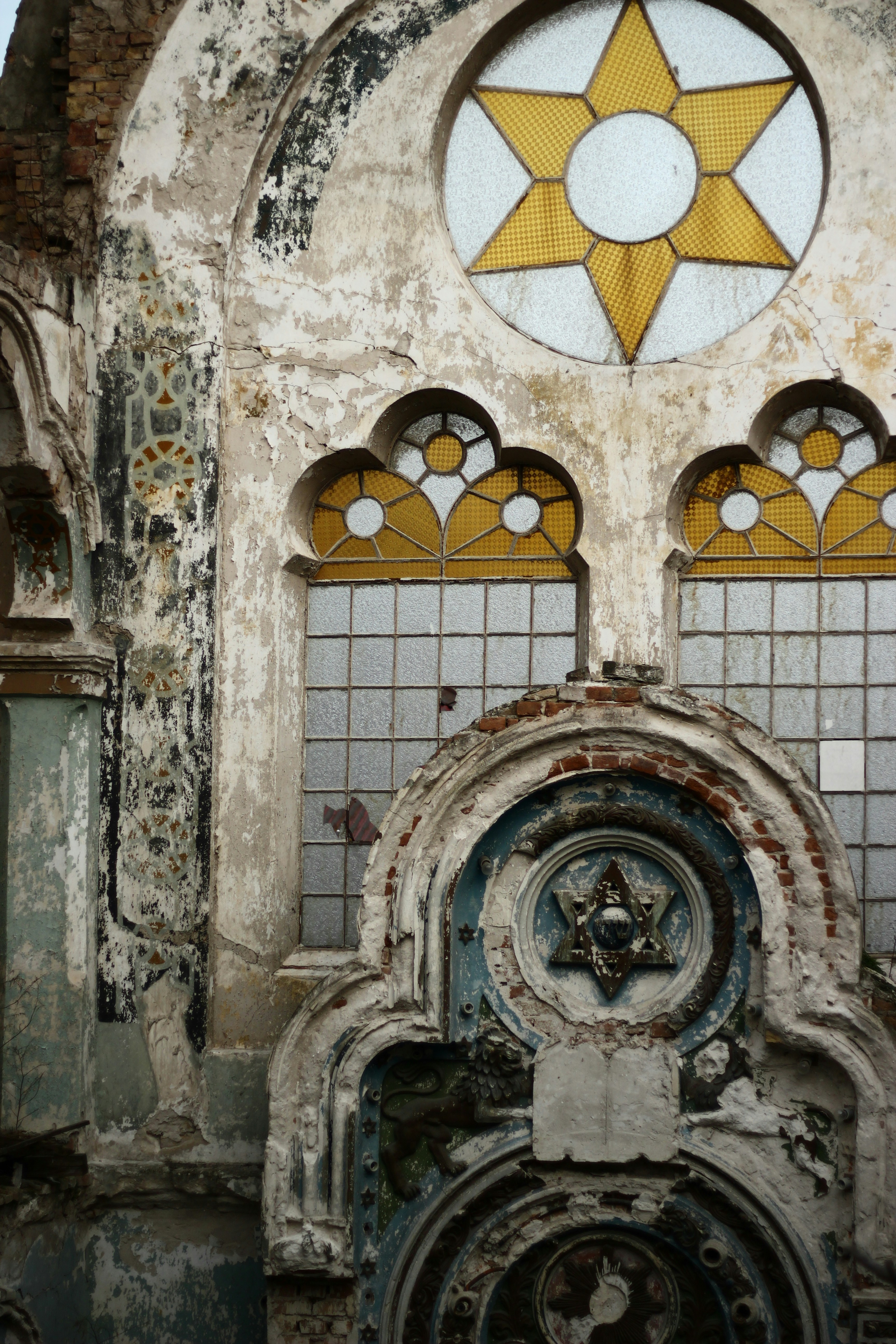 an old building with stained glass windows and a star on it