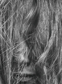 Side profile of tangled hair with visible dryness and lack of shine