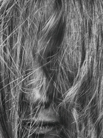 Side profile of tangled hair with visible dryness and lack of shine
