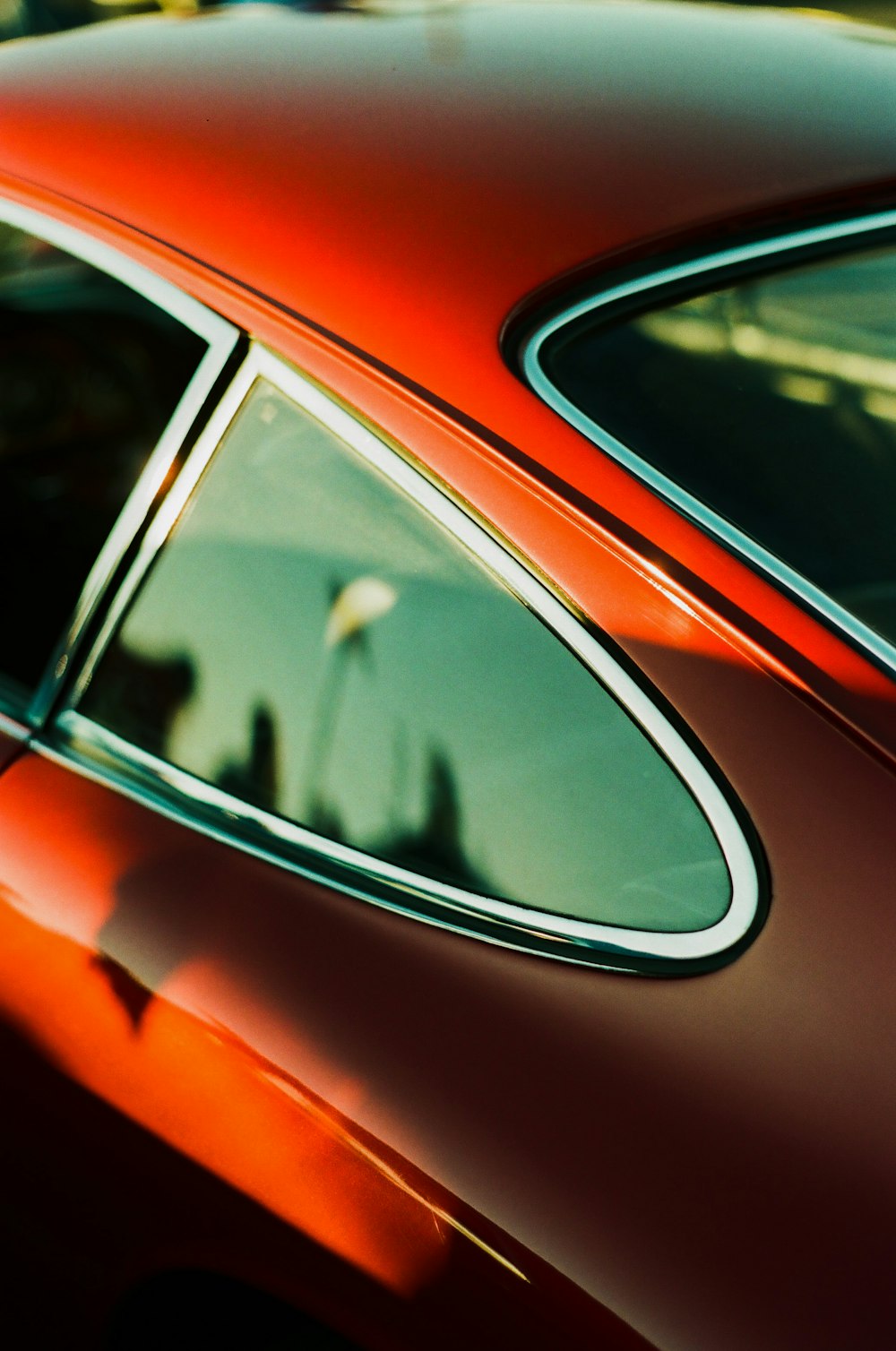 a close up of the side of a red car