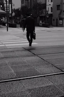 A Lexvita team member confidently walking through a busy city street with legal documents in hand.